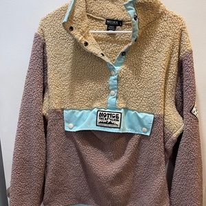 Notice the Reckless sweater